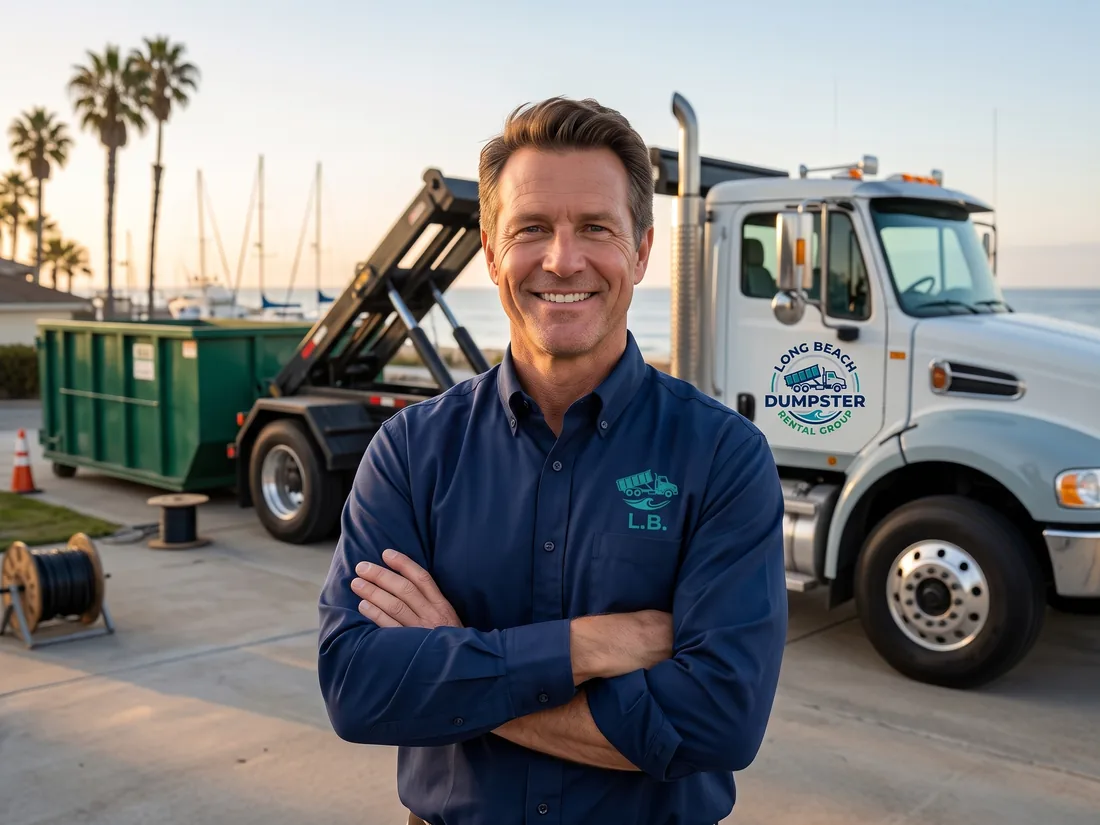 Terence McClay, owner of Long Beach Dumpster Rental Group, in front of a navy roll-off truck in Long Beach, CA